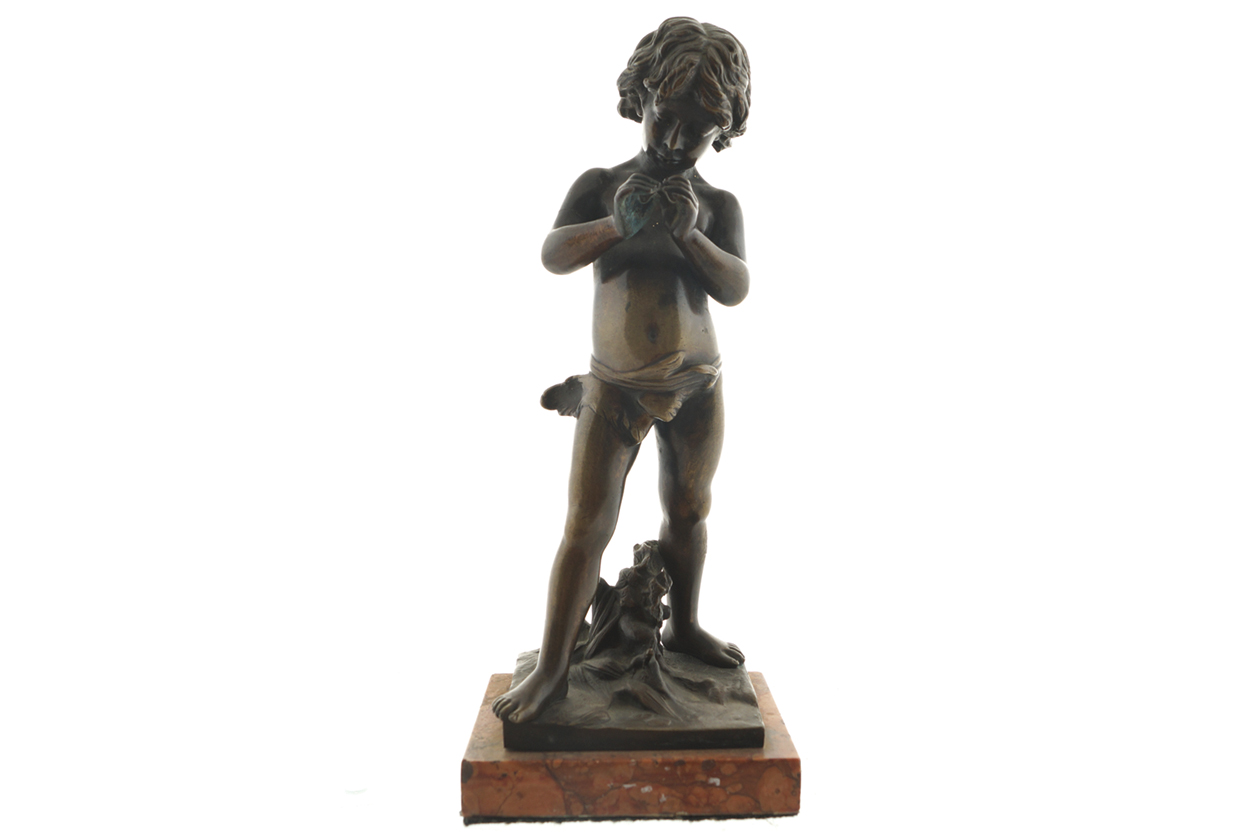 NINETEENTH-CENTURY FRENCH BRONZE SCULPTURE of a young boy, raised on a rouge royale marble base 27