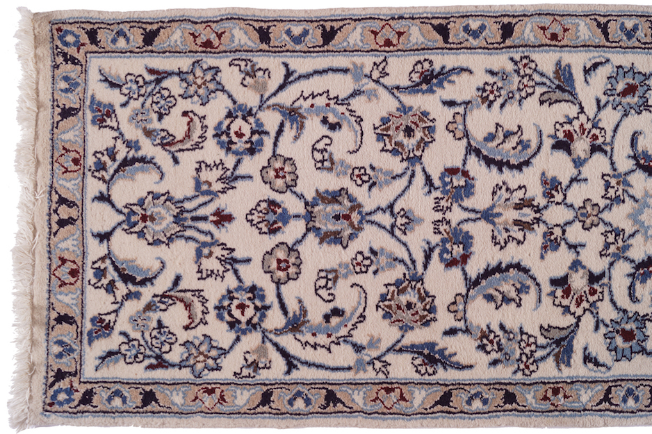 NAIN PERSIAN RUNNER on ivory ground, with all over design, and beige border 66 x 284 cm.