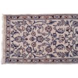 NAIN PERSIAN RUNNER on ivory ground, with all over design, and beige border 66 x 284 cm.