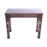 NINETEENTH-CENTURY MAHOGANY CHIPPENDALE SIDE TABLE the rectangular moulded edged top above a pierced