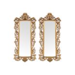 PAIR NINETEENTH-CENTURY CARVED GILT WOOD FLORENTINE PIER MIRRORS each with a rectangular plate