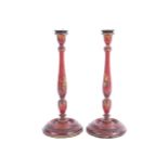PAIR OF GEORGIAN RED LACQUERED TALL STEMMED CANDLESTICKS each with Chinoiserie decoration, raised on