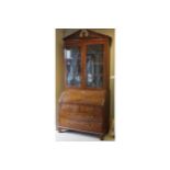 GEORGE III PERIOD MAHOGANY BUREAU BOOKCASE the superstructure with a moulded and dentil carved