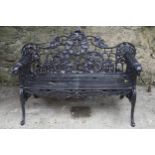 CAST IRON COALBROOKDALE GARDEN BENCH with ivy back and dogâ€™s head arms 100 cm. high; 150 cm. wide;