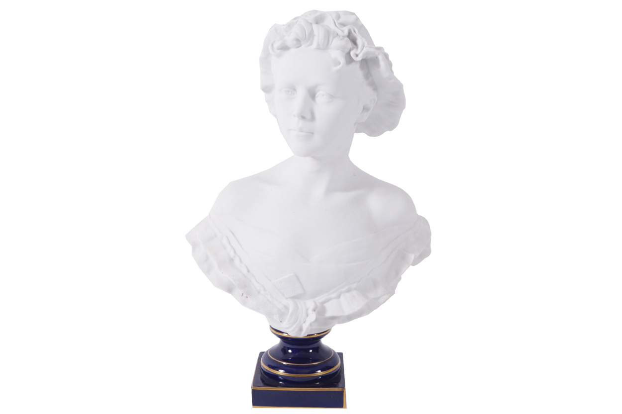 NINETEENTH-CENTURY BISQUE BUST raised on a royal blue sochel 57 cm. high