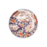 NINETEENTH-CENTURY CHINESE IMARI DISH of circular form with serpentine border 25 cm. diameter