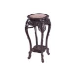 NINETEENTH-CENTURY CHINESE HARDWOOD PEDESTAL The circular serpentine shaped marble inset top,