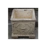 LARGE MOULDED STONE URN of square form 47 cm. high; 48 cm. wide; 48 cm. deep