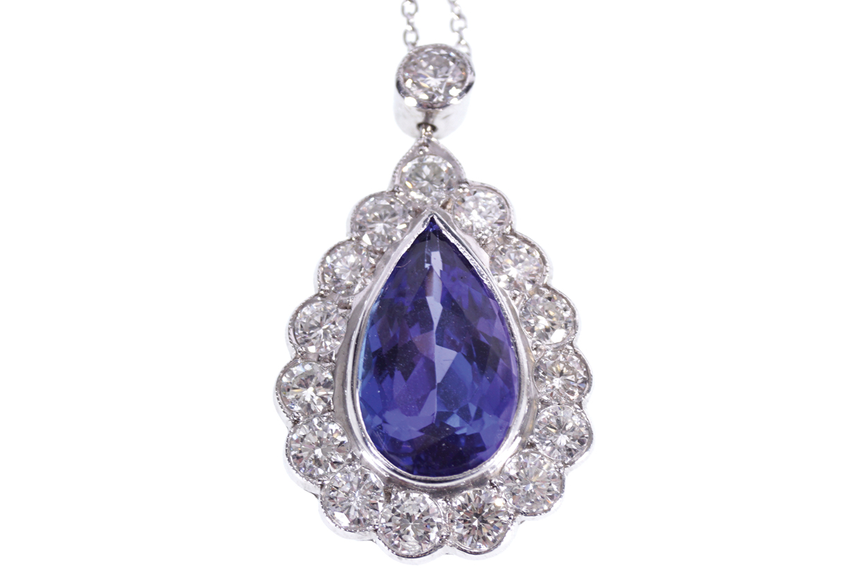 18 CT. GOLD, 4.2 CT. TANZANITE AND 1.69 CT. DIAMOND PENDANT