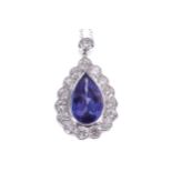 18 CT. GOLD, 4.2 CT. TANZANITE AND 1.69 CT. DIAMOND PENDANT