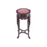 NINETEENTH-CENTURY CHINESE HARDWOOD PEDESTAL The circular serpentine shaped marble inset top above a