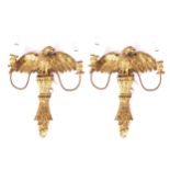 PAIR OF CARVED GILTWOOD WALL LIGHTS each enamating from a torch, surmounted by an eagle 50 x 30