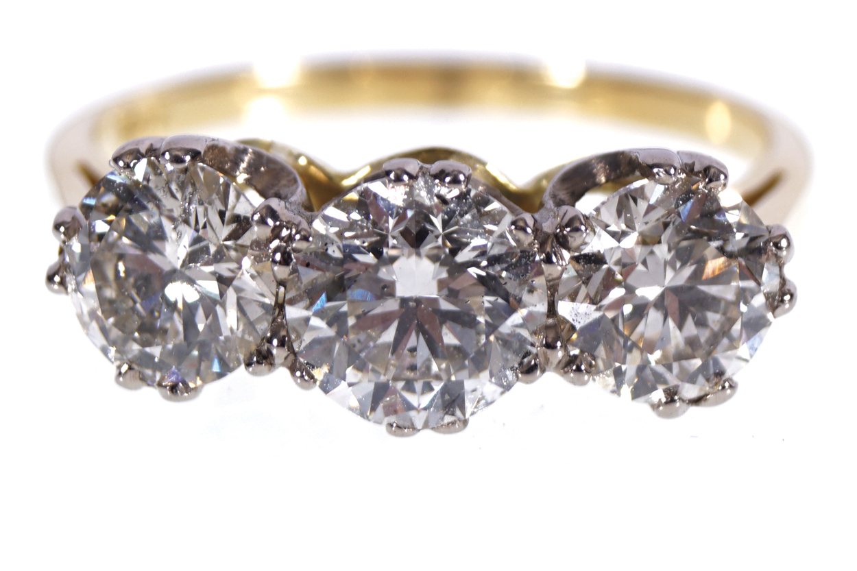 18 CT. YELLOW GOLD 2.95 CT. DIAMOND THREE-STONE RING