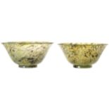 PAIR OF CHINESE QING PERIOD CELADON JADE BOWLS with spinach green inclusions 4.8 cm. high; 10 cm.