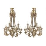 PAIR OF LARGE EARLY TWENTIETH CENTURY SIXTEEN BRANCH LOUIS XVI STYLE BRASS CHANDELIERS 124 cm. high;