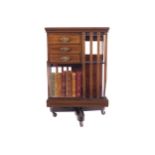 EDWARDIAN PERIOD MAHOGANY AND SATINWOOD CROSSBANDED REVOLVING BOOKCASE the square top above a series