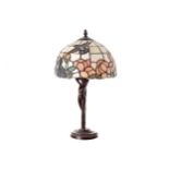 VINTAGE FIGURAL TABLE LAMP with Tiffany style glass shade 44 cm. high; 32 cm. diameter