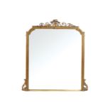 NINETEENTH-CENTURY GILT FRAMED OVER-MANTLE MIRROR the rectangular plate and top with serpentine