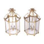 PAIR OF EDWARDIAN PERIOD BRASS HALL LANTERNS Each of Hexagonal form suspended on six scroll arms