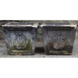 PAIR OF MOULDED STONE URNS of square tapered form 33 cm. high; 36 cm. square (2)