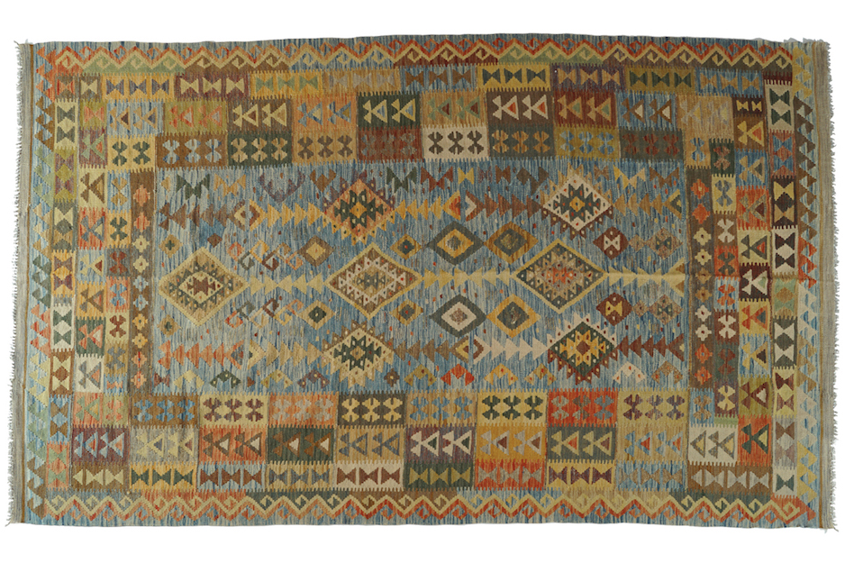 NORTHEAST PERSIAN KELIM VEG DYE CARPET on turquoise ground, with repeated diamond medallions, and