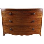 GEORGE III PERIOD MAHOGANY BOW FRONT CHEST, CIRCA 1800 of three drawers, furnished with turned