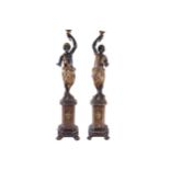 PAIR OF LATE EIGHTEENTH-CENTURY CARVED BLACKAMORE FIGURES each raised on an octagonal shaped base,