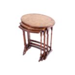 EDWARDIAN WALNUT NEST OF THREE TABLES each of oval form, raised on cabriole legs