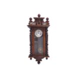 NINETEENTH-CENTURY VIENNA WALL CLOCK enclosed in a walnut frame 134 cm. high