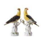 PAIR OF MEISSEN POLYCHROME PORCELAIN BIRDS each perched on a tree trunk 27 cm. high (2)