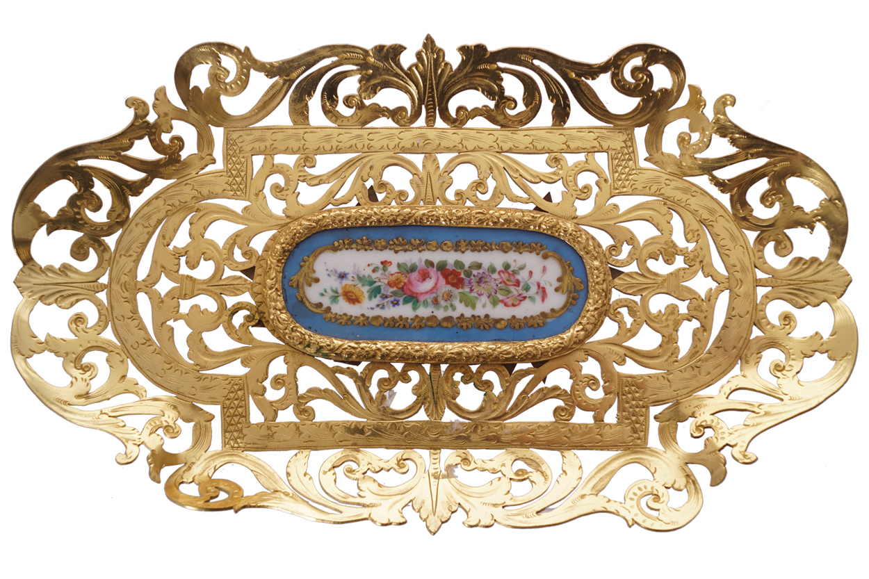 NINETEENTH-CENTURY ORMOLU AND SEVRES PORCELAIN TRAY of oval serpentine form with filigree border 2.5