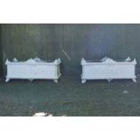 PAIR OF NINETEENTH-CENTURY FRENCH CAST IRON JARDINIÈRES of elongated rectangular form, raised on