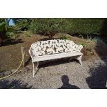 PAIR OF NINETEENTH-CENTURY CAST IRON GARDEN SEATS each with a fern leaf decorated back 90 cm.