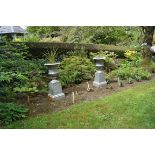 PAIR OF NINETEENTH-CENTURY CAST IRON GARDEN URNS AND STANDS 89 cm. high; 40 cm. diameter (2)