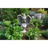 RECONSTITUTED STONE EAGLE mounted on a sphere 70 cm. high