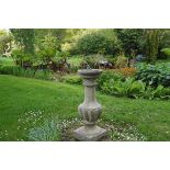 BRONZE SUNDIAL, STAMPED 1667 raised on a baluster stemmed base 90 cm. high; 44 cm. diameter