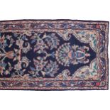 WEST PERSIAN MAHAL RUNNERwith indigo field vines and flower heads and red border415 x 88 cm.