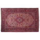 KASHAN CARPET CIRCA 1920on ivory ground with pole medallion large red border and outer red