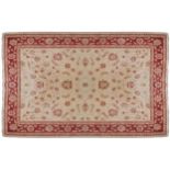 WEST PERSIAN ISFAHAN PATTERN CARPETon ivory ground with red border426 x 315 cm.