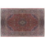 WEST PERSIAN KASHAN CARPET CIRCA 1880on red ground with navy border430 x 320 cm.