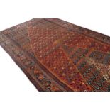 NORTH WEST PERSIAN BIDJAR CARPET CIRCA 1920with woven central ivory medallion611 x 226 cm.