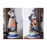 PAIR OF NINETEENTH-CENTURY AUSTRIAN POLYCHROME FIGURES Huntsman and a girl 30 cm. high