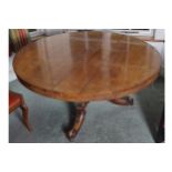 IRISH NINETEENTH-CENTURY ROSEWOOD DINING TABLE the circular top above a conforming frieze, raised on