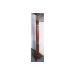 NINETEENTH-CENTURY MAHOGANY TORCHERE the circular top, raised on a reeded turned and square