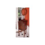 EDWARDIAN MAHOGANY GENT'S DRESSING TABLE the rectangular top with a projecting bow front, below a