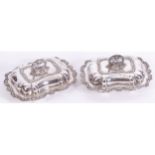 PAIR OF SHEFFIELD SILVER PLATED ENTRÉE DISHESeach of rectangular serpentine form with leaf and