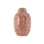 CHINESE QING PERIOD LIDDED PORCELAIN VASE with dense iron red decoration of lotus flowers. Mark of