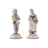 PAIR OF GERMAN PORCELAIN FIGURESBoy holding a chickenProvenance: The Estate of the late Timothy