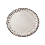 LARGE SILVER SALVERwith pie crust and leaf scroll border, enclosing an engraved plain, raised on