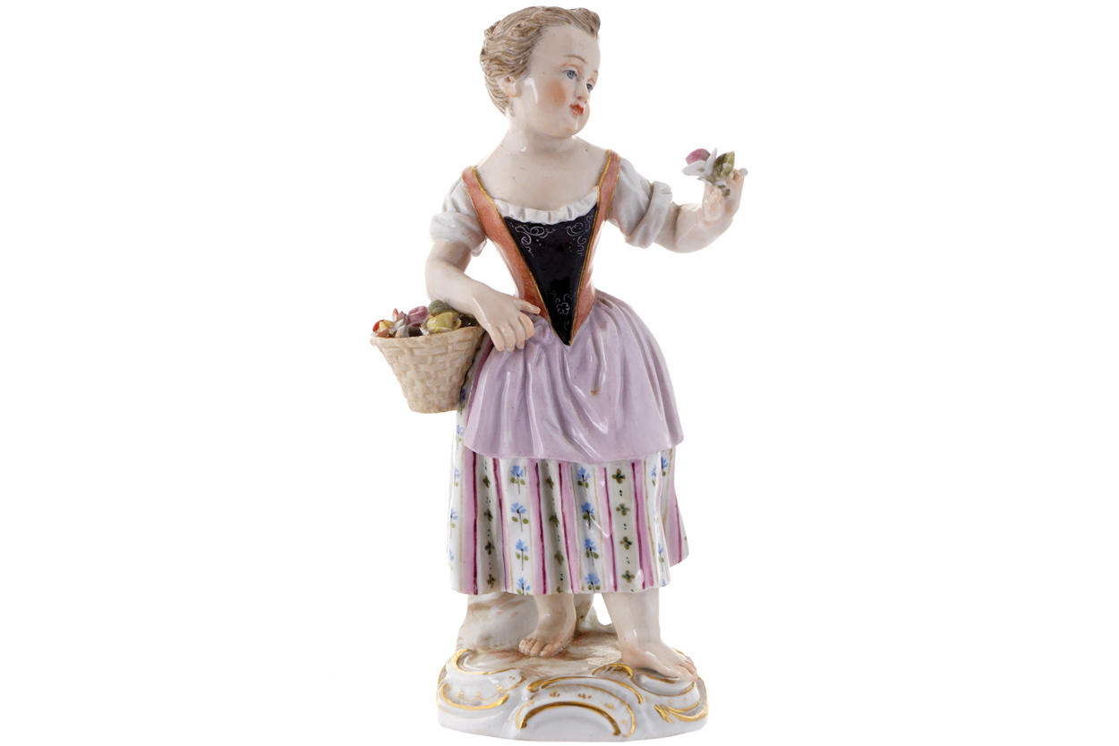 NINETEENTH-CENTURY MEISSEN FIGURE of a young girl holding a basket of fruit14 cm. high